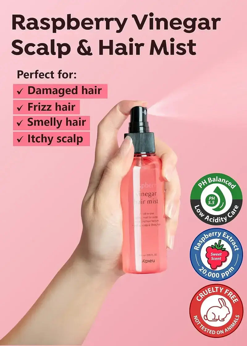 Zuzu Aura Raspberry Vinegar Scalp and Hair Mist in a pink spray bottle, perfect for damaged hair and frizz, sea salt mist for hair