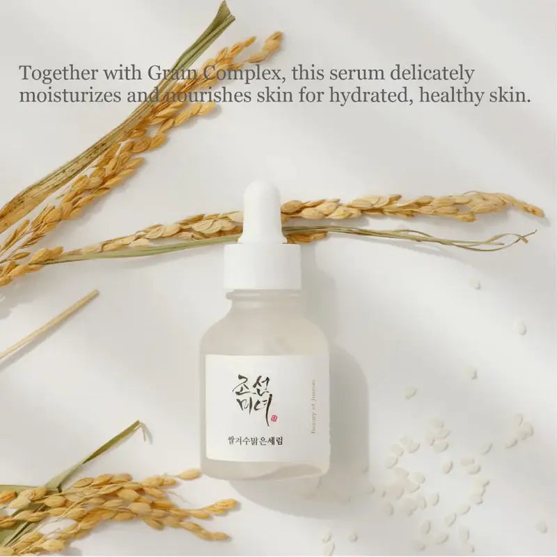 Beauty Of Joseon Rice Arbutin Serum in a bottle with rice grains, promoting hydrated, healthy skin