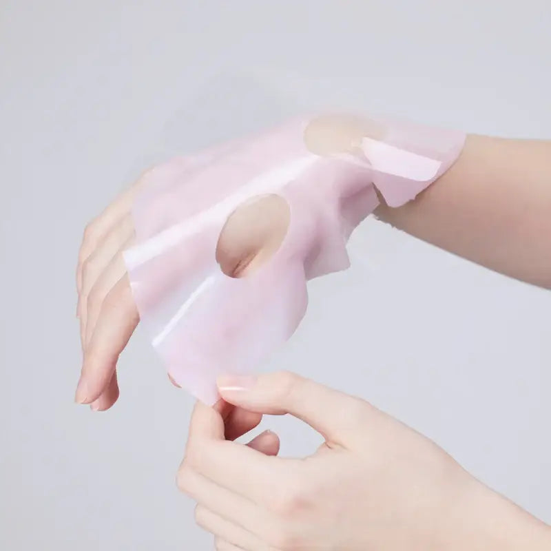 Cosrx Biodance Collagen Mask on hands showing its hydrating sheet design for skin rejuvenation