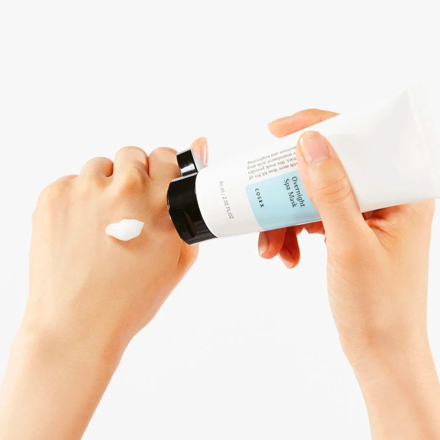 Cosrx brightening overnight mask 60ml being applied on hand with white cream texture