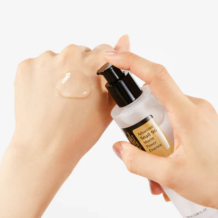 Cosrx Advanced Snail 96 Power Essence with snail mucin essence for face shown on a hand