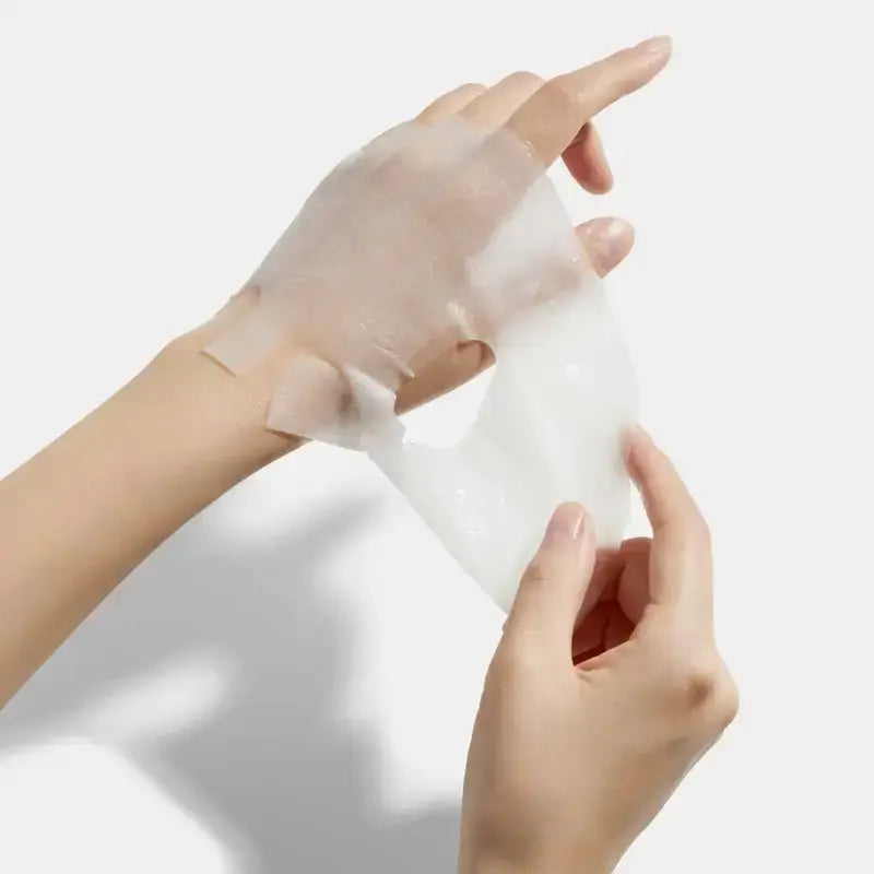 Zuzu Aura Biodance collagen mask being applied to the hand for hydration and rejuvenation