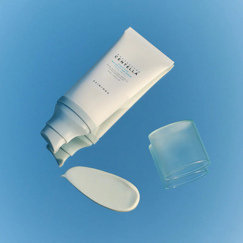 Skin1004 Centella sunscreen tube with swatch on blue background Korean SPF travel size skincare